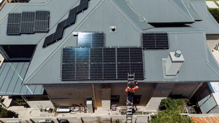 Eco Shine Solar technician cleaning solar panels