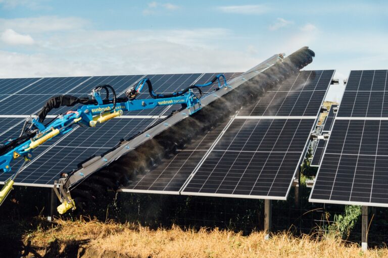 Sunbrush TrackFlex cleaning ground-mounted panels at a utility-scale solar farm